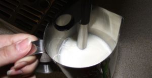 Frothing milk in a coffee machine