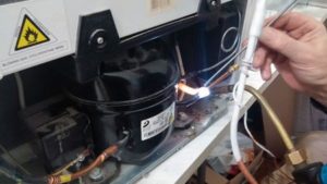 Soldering a capillary tube in a refrigerator