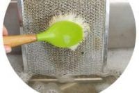 Cleaning the hood with a brush