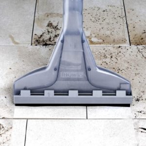 Washing tiles with a vacuum cleaner