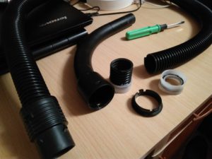 Repairing a vacuum cleaner hose with a cut