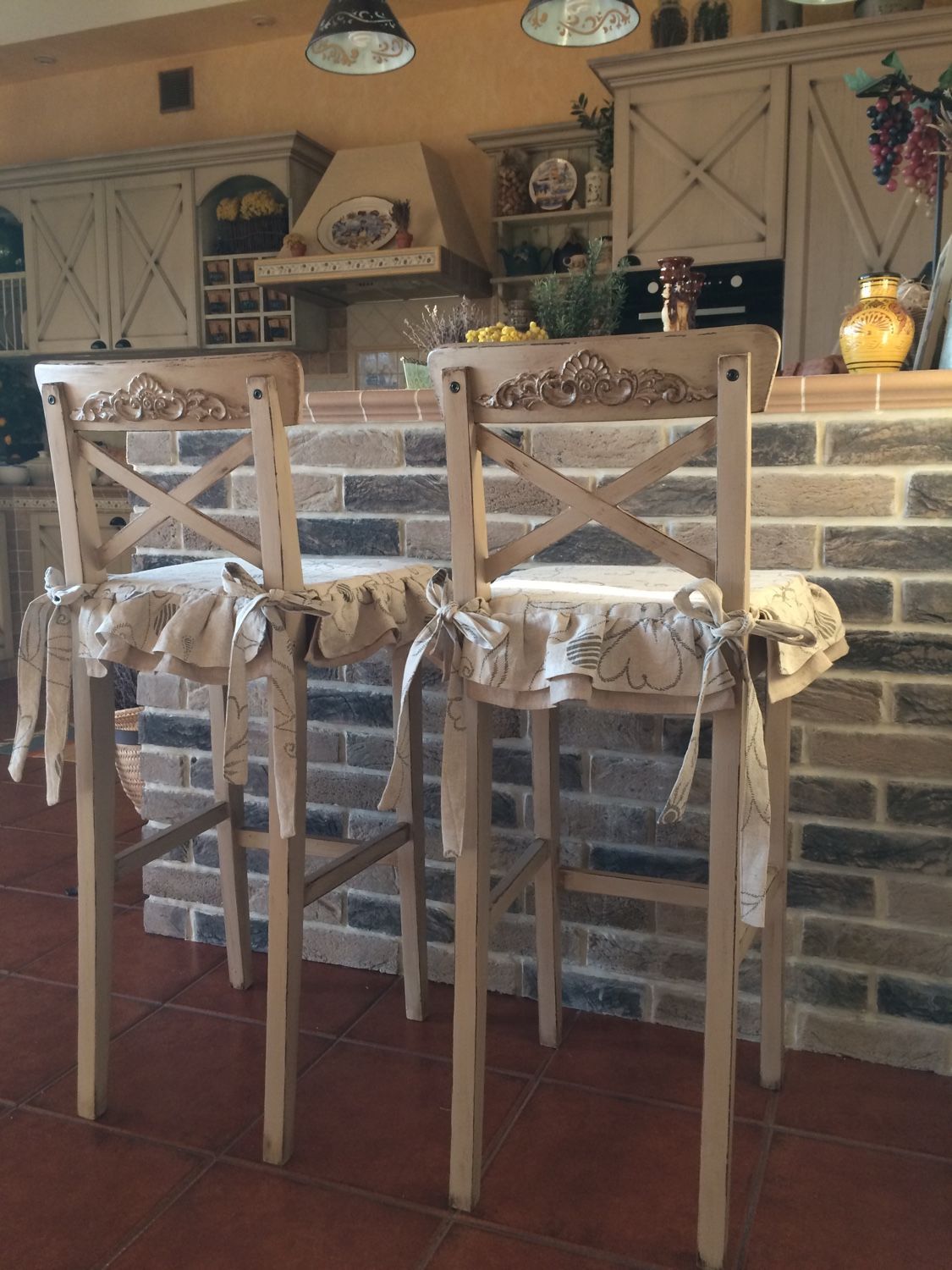 Bar stool cover made of fabric.