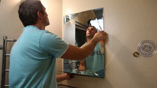 How to stick a mirror on a mirror.
