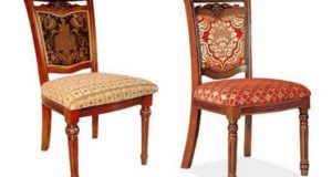 Chairs upholstered in fabric.