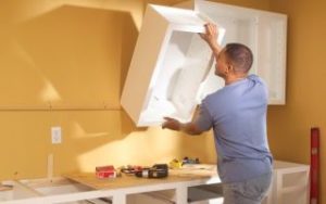 Hang a cabinet in the kitchen