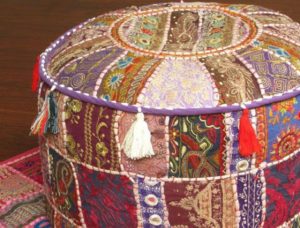 Fabric cover for an ottoman made from bottles.