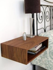 Wall-mounted bedside table.