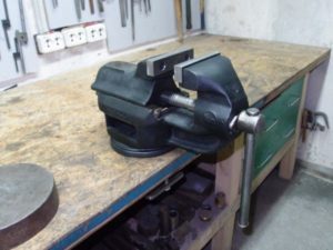 Installing a vice on a table in the garage