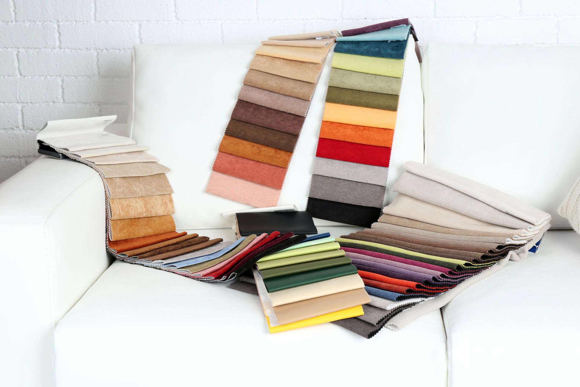 Selecting fabric for upholstering a chair.