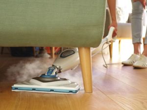 Removing dirt with a steam mop