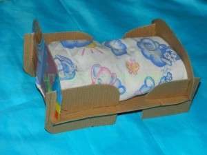 Collapsible bed for a doll.