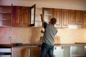 At what height should you hang kitchen cabinets?
