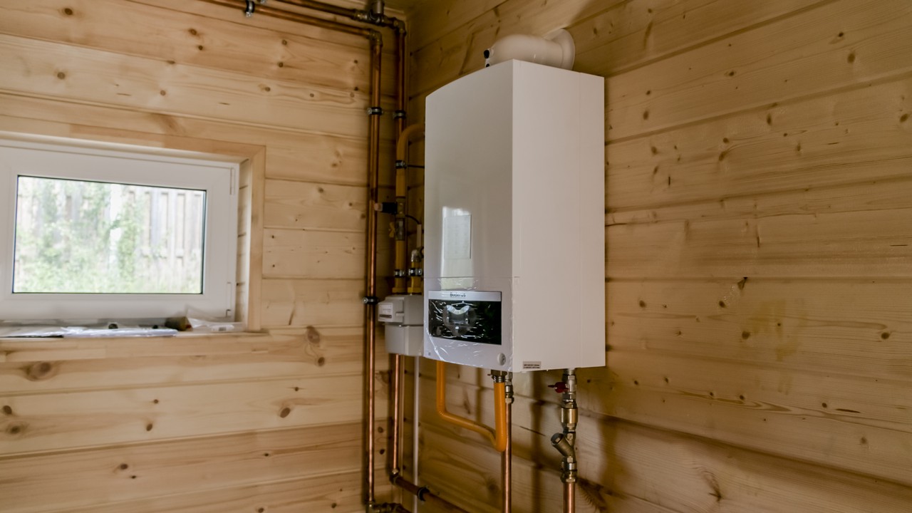 installation of a wall-mounted gas boiler in a private house