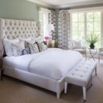 White bed in the bedroom interior with photo.