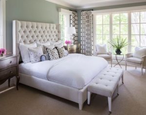 White bed in the bedroom interior with photo.