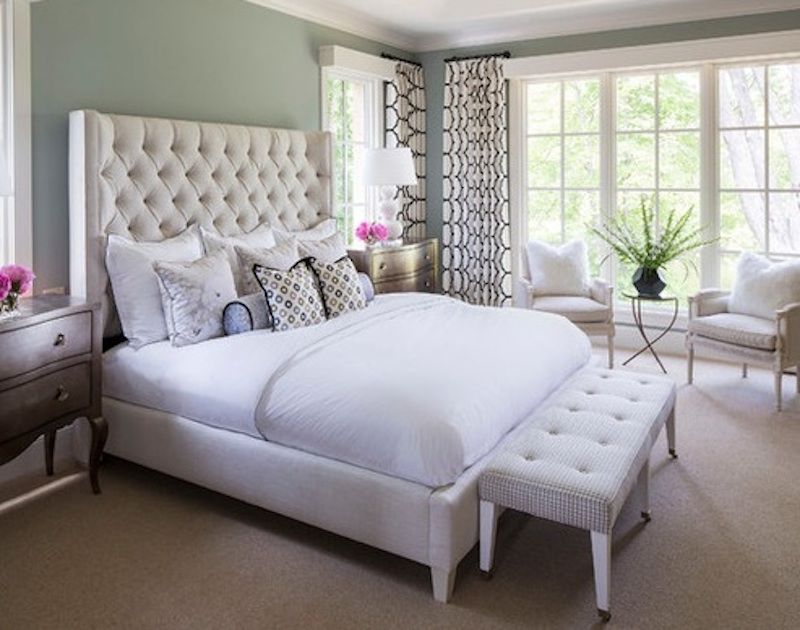 White bed in the bedroom interior with photo.