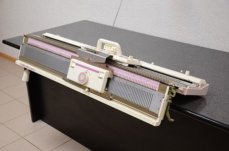 The working principle of a knitting machine.