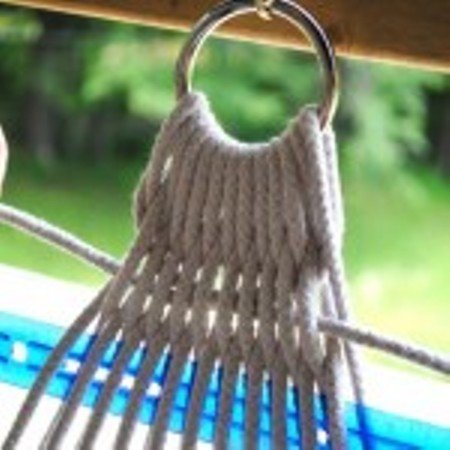 Fastening the hammock with eyelets.
