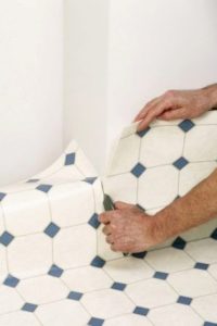 How to lay linoleum in a room with furniture