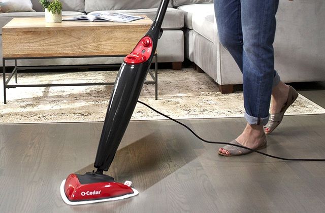 Cleaning parquet flooring with a steam mop.