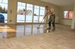 Painting parquet with a roller