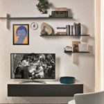 Shelves above the TV in the living room