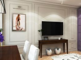 TV can be hung above a small oblong bedside table