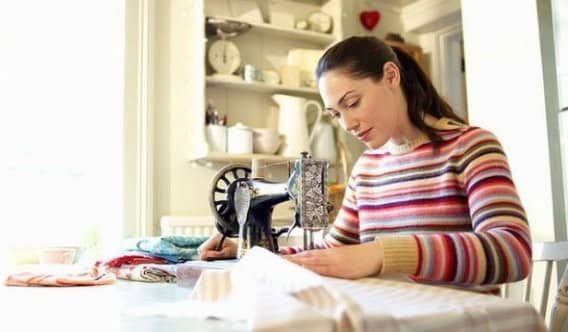 Learning to sew on a sewing machine.