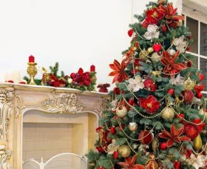 Decorating the Christmas tree with artificial flowers