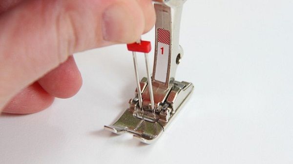 Installing a double needle in a sewing machine.
