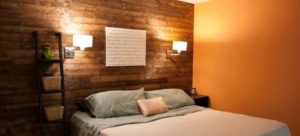 The height of the sconce above the bed in the bedroom.