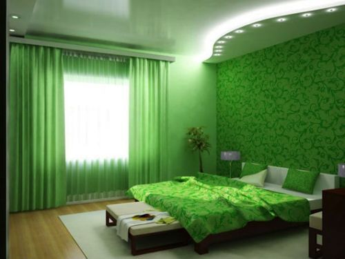 Green curtains in the bedroom interior