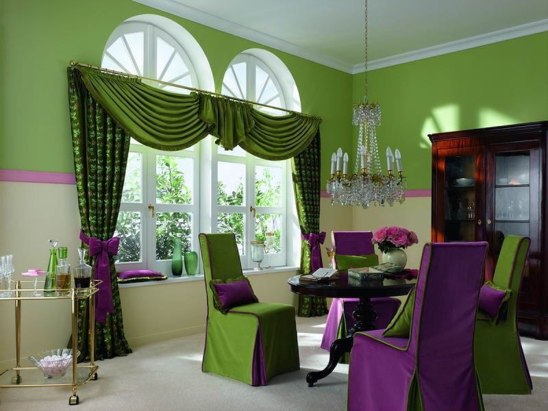 Green curtains in the bedroom interior