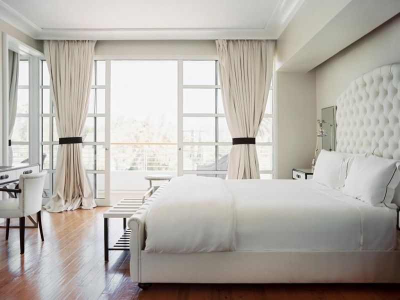 White curtains in the bedroom interior