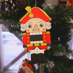 decorating the Nutcracker toy for the Christmas tree
