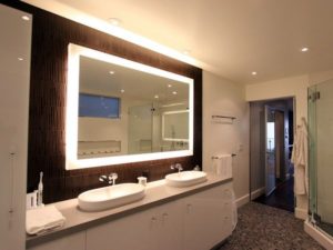 using an illuminated mirror in the bathroom