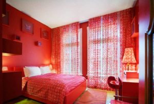 selection of furniture when decorating a bedroom in red tones