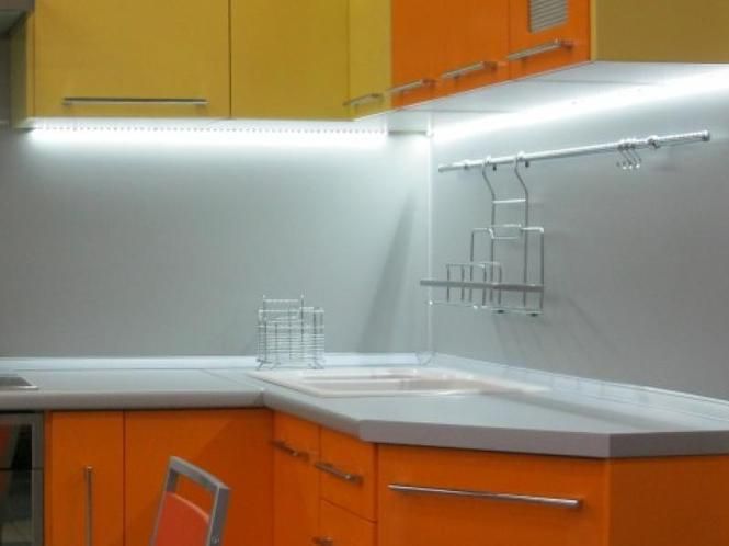 Glue the LED strip to the kitchen unit