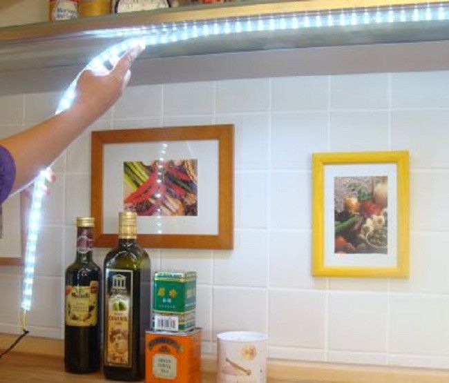 Glue the LED strip to the kitchen unit