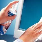 Using special sprays to clean monitors.