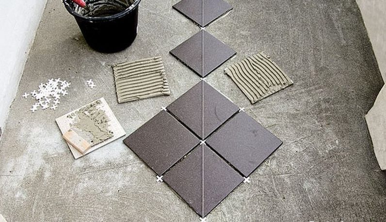 Laying tiles from the center.