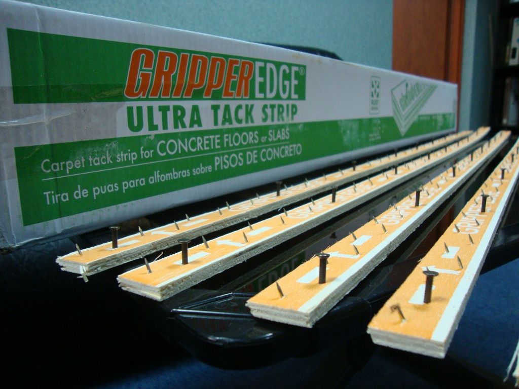 Gripper strip for laying carpet.