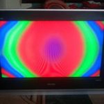 Colored spots on the TV screen.