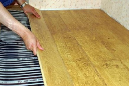 Warm floor under parquet boards
