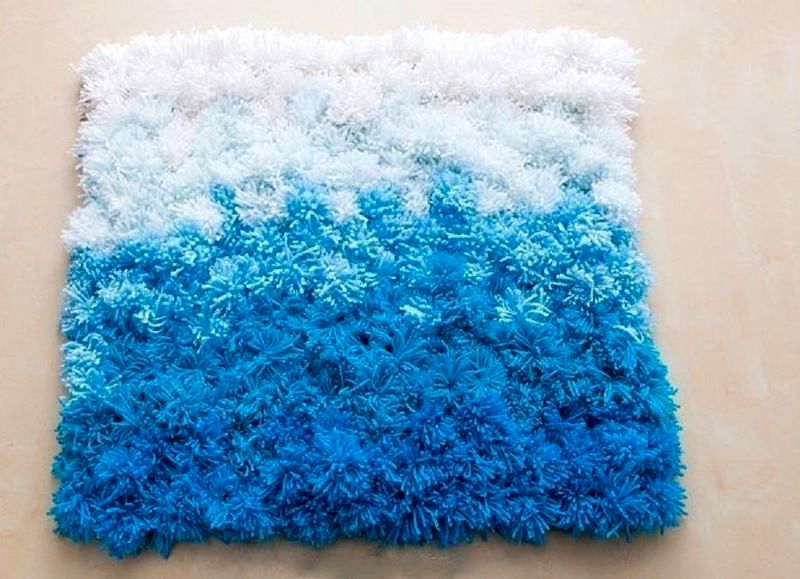 blue and white pompom rug