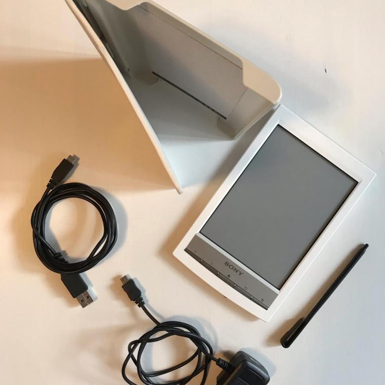 Reader with charging cable.