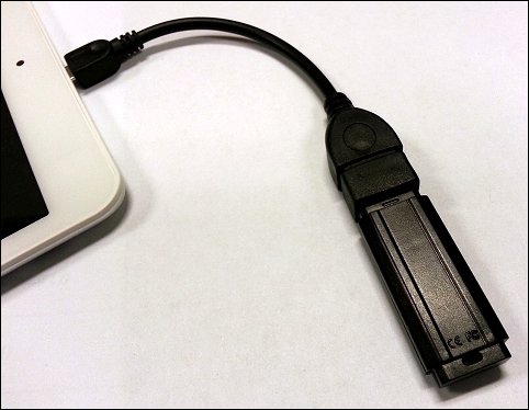 Connecting a flash drive via an adapter.