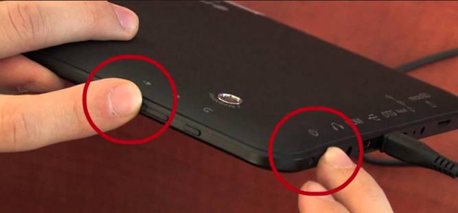 Hold the volume button and the power button.