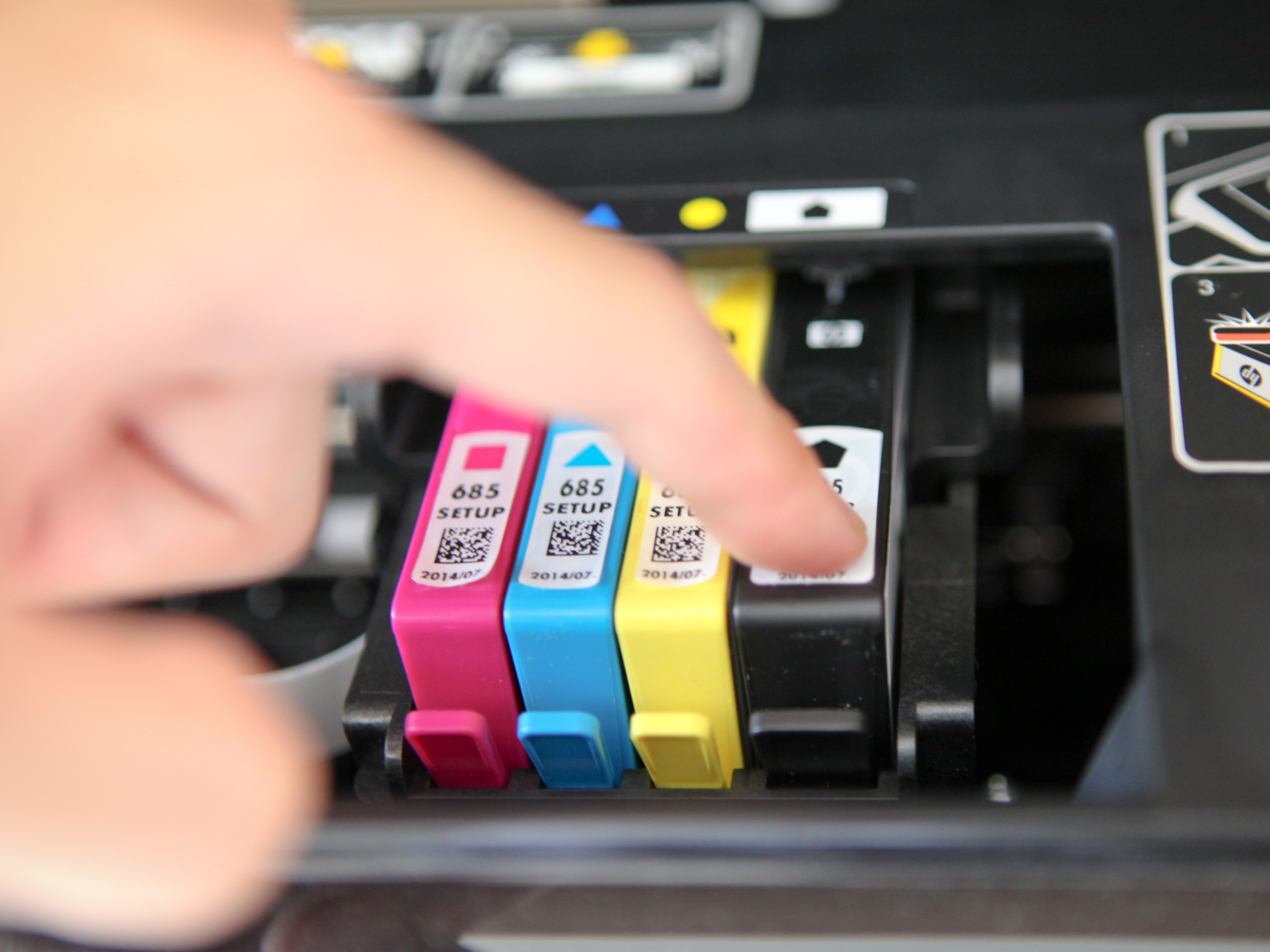 Where is the cartridge located in the printer?
