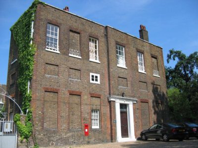 house with boarded up windows